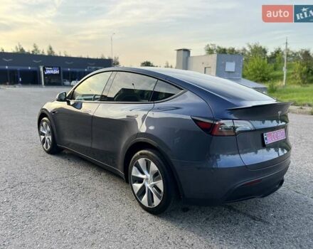 Серый Тесла Model Y, объемом двигателя 0 л и пробегом 22 тыс. км за 28999 $, фото 1 на Automoto.ua