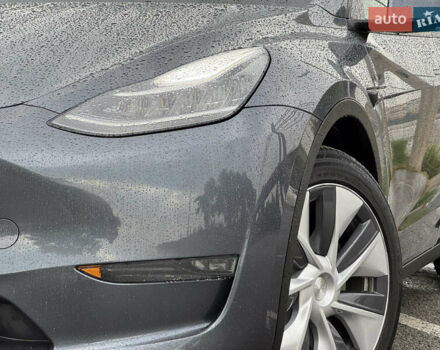 Серый Тесла Model Y, объемом двигателя 0 л и пробегом 66 тыс. км за 27900 $, фото 2 на Automoto.ua
