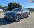 Серый Тесла Model Y, объемом двигателя 0 л и пробегом 24 тыс. км за 30999 $, фото 1 на Automoto.ua
