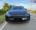 Серый Тесла Model Y, объемом двигателя 0 л и пробегом 27 тыс. км за 28900 $, фото 1 на Automoto.ua