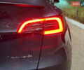 Серый Тесла Model Y, объемом двигателя 0 л и пробегом 72 тыс. км за 29999 $, фото 3 на Automoto.ua