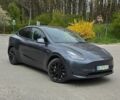 Серый Тесла Model Y, объемом двигателя 0 л и пробегом 54 тыс. км за 26999 $, фото 1 на Automoto.ua