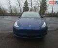 Синий Тесла Model Y, объемом двигателя 0 л и пробегом 63 тыс. км за 18000 $, фото 1 на Automoto.ua