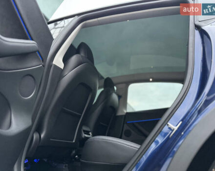 Синий Тесла Model Y, объемом двигателя 0 л и пробегом 88 тыс. км за 31990 $, фото 47 на Automoto.ua