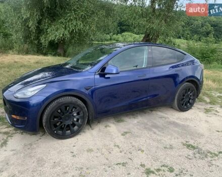 Синий Тесла Model Y, объемом двигателя 0 л и пробегом 75 тыс. км за 22900 $, фото 2 на Automoto.ua