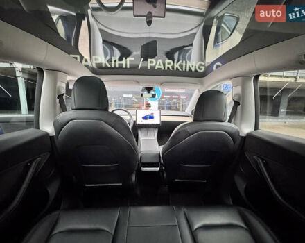 Синий Тесла Model Y, объемом двигателя 0 л и пробегом 104 тыс. км за 22900 $, фото 3 на Automoto.ua