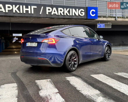 Синий Тесла Model Y, объемом двигателя 0 л и пробегом 104 тыс. км за 22900 $, фото 2 на Automoto.ua