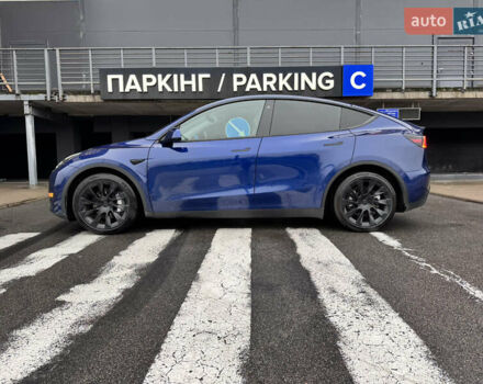 Синий Тесла Model Y, объемом двигателя 0 л и пробегом 104 тыс. км за 22900 $, фото 1 на Automoto.ua
