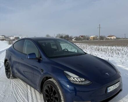 Синий Тесла Model Y, объемом двигателя 0 л и пробегом 88 тыс. км за 21699 $, фото 1 на Automoto.ua