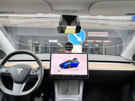 Синий Тесла Model Y, объемом двигателя 0 л и пробегом 104 тыс. км за 22900 $, фото 1 на Automoto.ua
