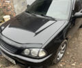 Черный Тойота Авенсис, объемом двигателя 1.6 л и пробегом 400 тыс. км за 4150 $, фото 1 на Automoto.ua