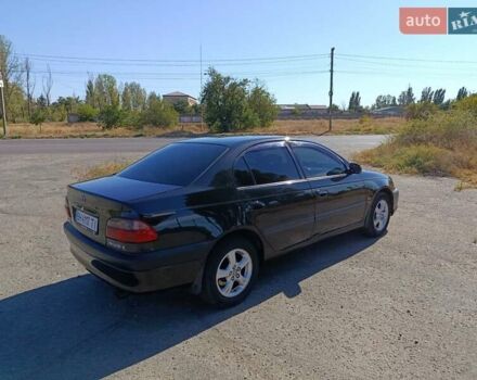 Черный Тойота Авенсис, объемом двигателя 2 л и пробегом 385 тыс. км за 3850 $, фото 7 на Automoto.ua