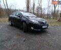Черный Тойота Авенсис, объемом двигателя 2 л и пробегом 177 тыс. км за 11600 $, фото 1 на Automoto.ua