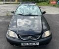 Черный Тойота Авенсис, объемом двигателя 1.6 л и пробегом 317 тыс. км за 3600 $, фото 1 на Automoto.ua