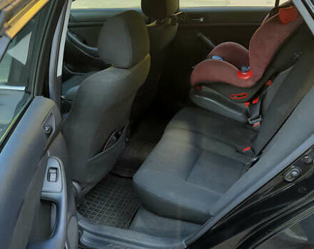 Черный Тойота Авенсис, объемом двигателя 2 л и пробегом 198 тыс. км за 5300 $, фото 9 на Automoto.ua