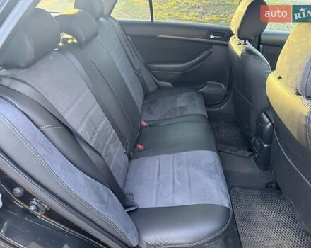 Черный Тойота Авенсис, объемом двигателя 2 л и пробегом 430 тыс. км за 6000 $, фото 4 на Automoto.ua