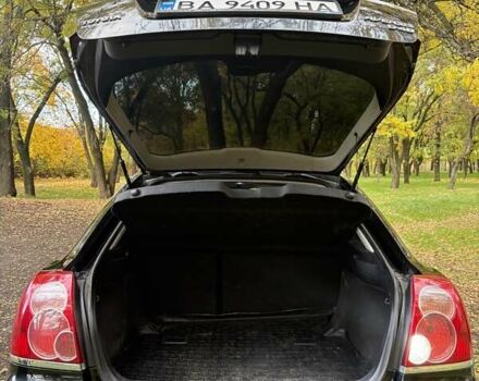 Черный Тойота Авенсис, объемом двигателя 2 л и пробегом 235 тыс. км за 6000 $, фото 1 на Automoto.ua