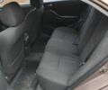 Коричневый Тойота Авенсис, объемом двигателя 2 л и пробегом 236 тыс. км за 5200 $, фото 4 на Automoto.ua