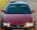 Красный Тойота Авенсис, объемом двигателя 2 л и пробегом 314 тыс. км за 3800 $, фото 1 на Automoto.ua