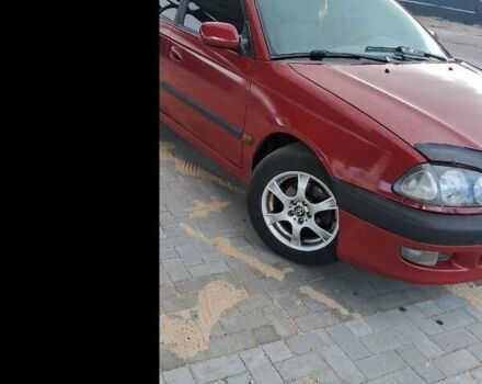 Красный Тойота Авенсис, объемом двигателя 1.8 л и пробегом 319 тыс. км за 3200 $, фото 1 на Automoto.ua