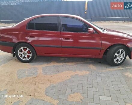 Красный Тойота Авенсис, объемом двигателя 1.8 л и пробегом 319 тыс. км за 3200 $, фото 4 на Automoto.ua