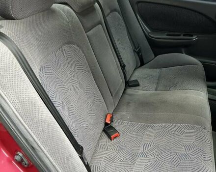 Красный Тойота Авенсис, объемом двигателя 1.76 л и пробегом 306 тыс. км за 3500 $, фото 10 на Automoto.ua