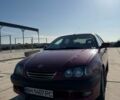 Красный Тойота Авенсис, объемом двигателя 1.8 л и пробегом 311 тыс. км за 3200 $, фото 1 на Automoto.ua