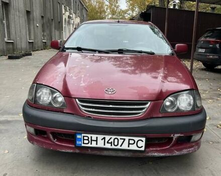 Красный Тойота Авенсис, объемом двигателя 1.76 л и пробегом 306 тыс. км за 3500 $, фото 1 на Automoto.ua