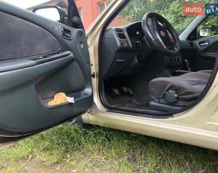 Желтый Тойота Авенсис, объемом двигателя 2 л и пробегом 249 тыс. км за 4000 $, фото 11 на Automoto.ua