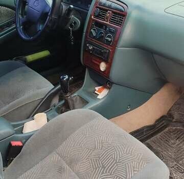 Зеленый Тойота Авенсис, объемом двигателя 1.8 л и пробегом 310 тыс. км за 3200 $, фото 1 на Automoto.ua