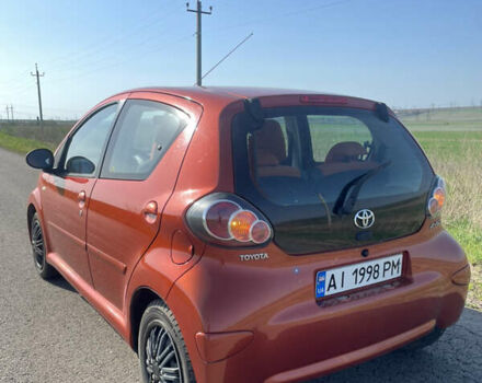 Оранжевый Тойота Айго, объемом двигателя 1 л и пробегом 148 тыс. км за 5500 $, фото 1 на Automoto.ua