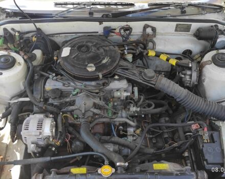 Белый Тойота Камри, объемом двигателя 1.8 л и пробегом 300 тыс. км за 1000 $, фото 1 на Automoto.ua