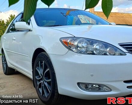 Білий Тойота Камрі, об'ємом двигуна 2.4 л та пробігом 255 тис. км за 5300 $, фото 1 на Automoto.ua