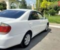 Белый Тойота Камри, объемом двигателя 2.4 л и пробегом 180 тыс. км за 7500 $, фото 1 на Automoto.ua