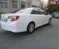 Белый Тойота Камри, объемом двигателя 2.49 л и пробегом 250 тыс. км за 10600 $, фото 3 на Automoto.ua