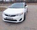 Белый Тойота Камри, объемом двигателя 2.4 л и пробегом 297 тыс. км за 10000 $, фото 1 на Automoto.ua