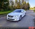 Белый Тойота Камри, объемом двигателя 2.5 л и пробегом 128 тыс. км за 12500 $, фото 1 на Automoto.ua