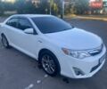 Белый Тойота Камри, объемом двигателя 2.5 л и пробегом 185 тыс. км за 12900 $, фото 1 на Automoto.ua