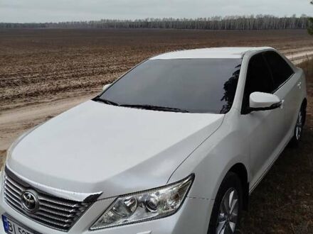 Белый Тойота Камри, объемом двигателя 2.5 л и пробегом 196 тыс. км за 11750 $, фото 1 на Automoto.ua