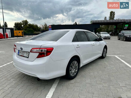 Белый Тойота Камри, объемом двигателя 2.5 л и пробегом 144 тыс. км за 11800 $, фото 1 на Automoto.ua