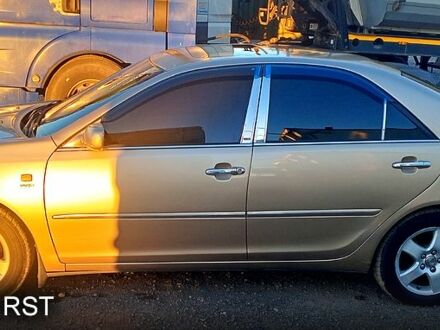 Бежевый Тойота Камри, объемом двигателя 2.4 л и пробегом 266 тыс. км за 5500 $, фото 1 на Automoto.ua