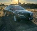 Чорний Тойота Камрі, об'ємом двигуна 2.4 л та пробігом 174 тис. км за 7800 $, фото 1 на Automoto.ua