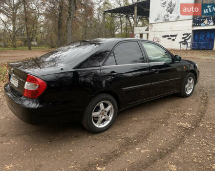 Чорний Тойота Камрі, об'ємом двигуна 2.4 л та пробігом 201 тис. км за 6999 $, фото 6 на Automoto.ua