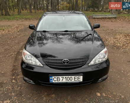 Чорний Тойота Камрі, об'ємом двигуна 2.4 л та пробігом 201 тис. км за 6999 $, фото 1 на Automoto.ua