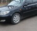 Черный Тойота Камри, объемом двигателя 2.4 л и пробегом 298 тыс. км за 5200 $, фото 1 на Automoto.ua