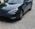 Черный Тойота Камри, объемом двигателя 2.4 л и пробегом 307 тыс. км за 4500 $, фото 1 на Automoto.ua