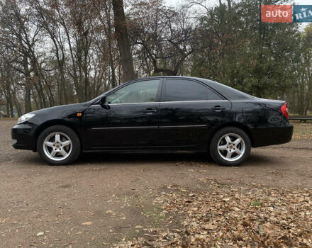 Чорний Тойота Камрі, об'ємом двигуна 2.4 л та пробігом 201 тис. км за 6999 $, фото 13 на Automoto.ua