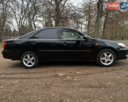 Чорний Тойота Камрі, об'ємом двигуна 2.4 л та пробігом 201 тис. км за 6999 $, фото 5 на Automoto.ua