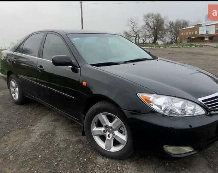 Черный Тойота Камри, объемом двигателя 3 л и пробегом 325 тыс. км за 6000 $, фото 1 на Automoto.ua