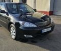 Черный Тойота Камри, объемом двигателя 2.4 л и пробегом 260 тыс. км за 6600 $, фото 1 на Automoto.ua